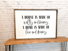 Load image into Gallery viewer, A house is made of walls and beams A home is made of love and dreams | framed wood sign