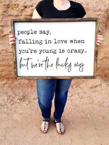 People say falling in love when you're young is crazy. but we're the lucky ones framed wood sign | Wall decor | Above over the bed wall art