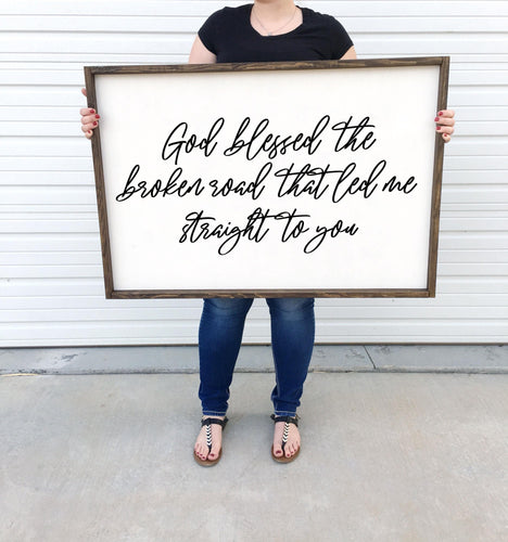 God blessed the broken road that led me straight to you framed Wood Sign Country Song Lyric Wall Decor above over the bed wall art